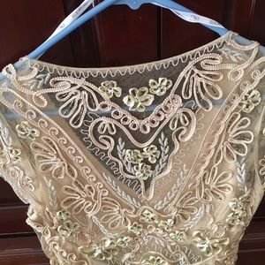 Short lacy dress very fancy.